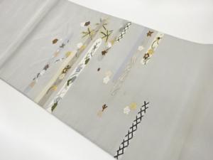 綴れ変わり横段に松・花葉模様織出し名古屋帯